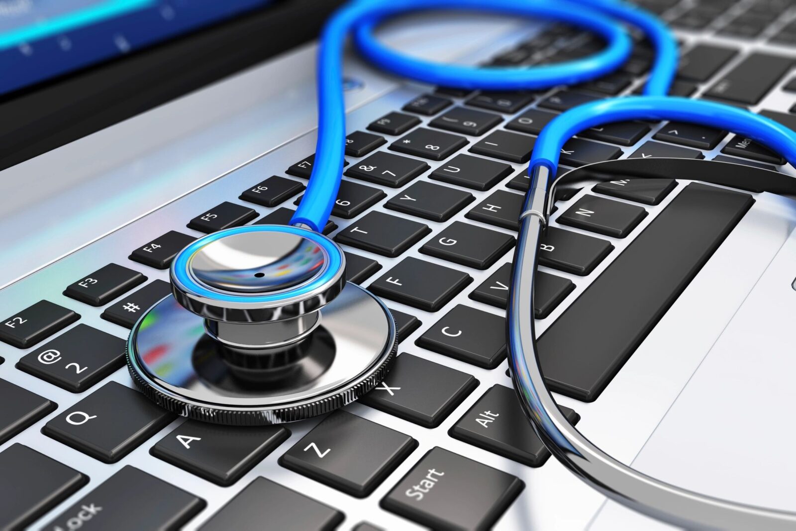 image of stethoscope resting on a computer keyboard