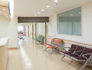 Empty seats and hallway near a hospital nurse's station