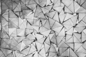 abstract, black and white photo of what may be triangles of wood