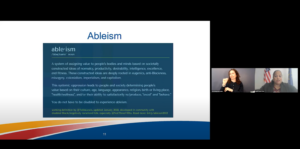 Screengrab of the NIDILRR Research Long Range Planning Stakeholder Follow Up Webinar on April 20, 2023. On the left, there is a slide with the working definition of “Ableism” by Talila Lewis. At the top of the slide, the word “ableism” is followed by its pronunciation and the word, “noun.” Below, the definition reads, “A system of assigning value to people’s bodies and minds based on societally constructed ideas of normalcy, productivity, desirability, intelligence, excellence, and fitness. These constructed ideas are deeply rooted in eugenics, anti-Blackness, misogyny, colonialism, imperialism, and capitalism. This systemic oppression leads to people and society determining people’s value based on their culture, age, language, appearance, religion, birth or living place, ‘health/wellness’, and/or their ability to satisfactorily re/produce, ‘excel’ and ‘behave.’ You do not have to be disabled to experience ableism.” Below the definition, yellow text reads, “Working definition by @TalilaLewis, updated January 2022, developed in community with disabled Black/negatively racialized folk, especially @NotThreeFifths.” On the right, there is an ASL interpreter with light skin wearing a black shirt. On the right of the ASL interpreter, there is a woman with brown skin and long black hair up in a ponytail wearing a red shirt with flowers and a black suit jacket.